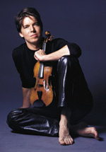 Joshua Bell in black leather pants with bare feet